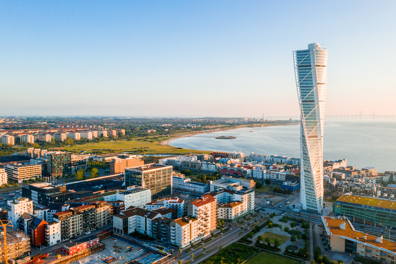 Beautiful aerial view of the Vastra Hamnen (The Western Harbour) district in Malmo, Sweden, during sunset. View from above.