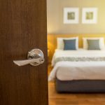 door handles open while lighting glowing bedroom